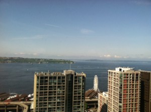 Downtown Seattle shimmers under blue skies Wednesday morning. Rain returns to the city on Thursday.